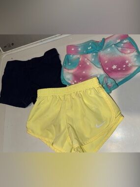 Nike Yellow Athletic Shorts with Navy and Pastel Star Print Pair